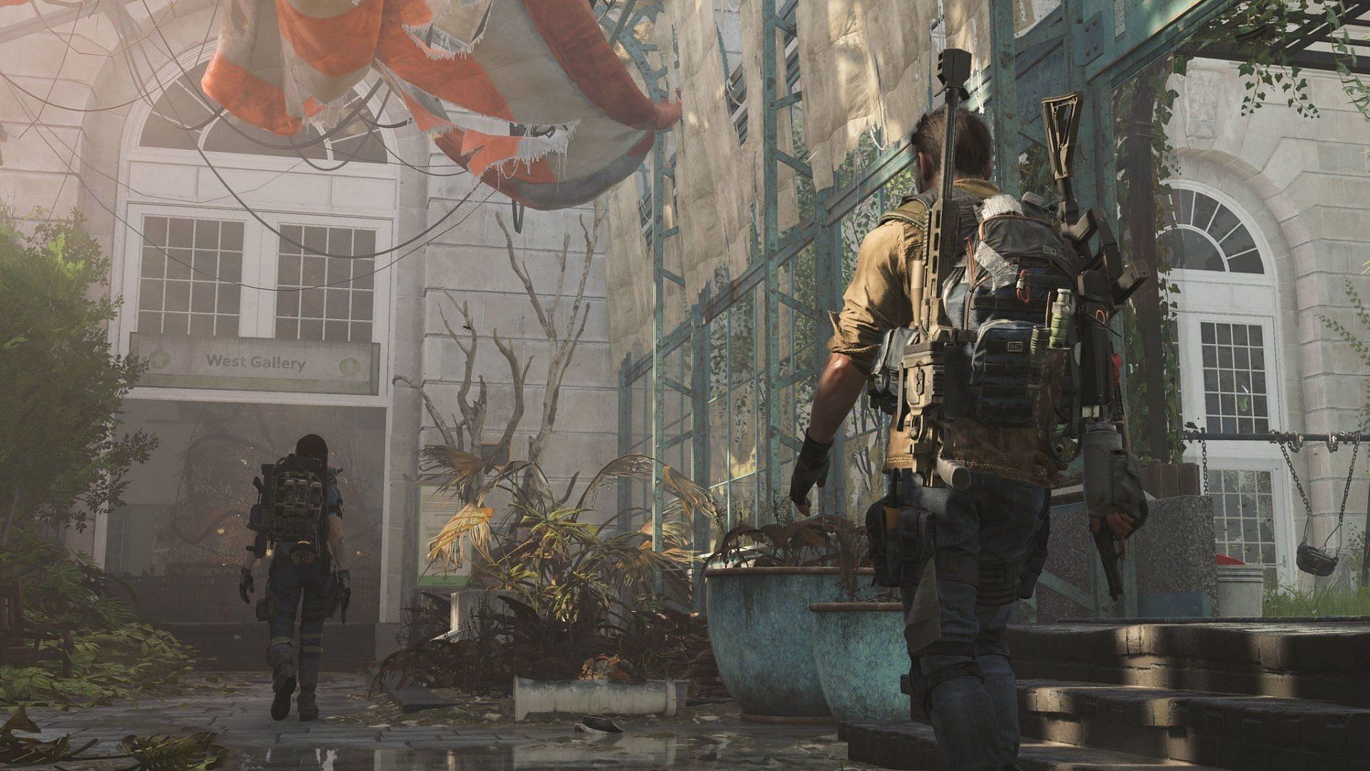 Division 2 artwork featuring the player character equipped with gear items and weapons