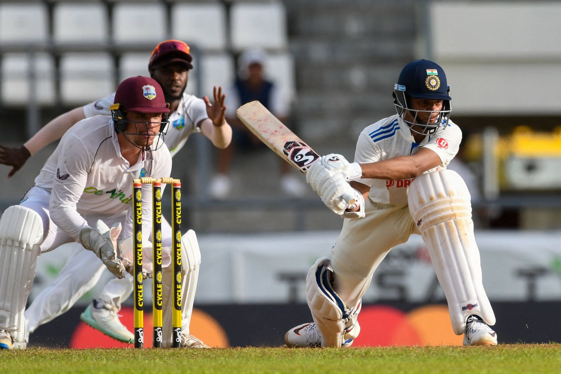 Yashasvi Jaiswal reverse swept Jomel Warrican for a boundary in the last over of the first day&#039;s play. [P/C: BCCI]