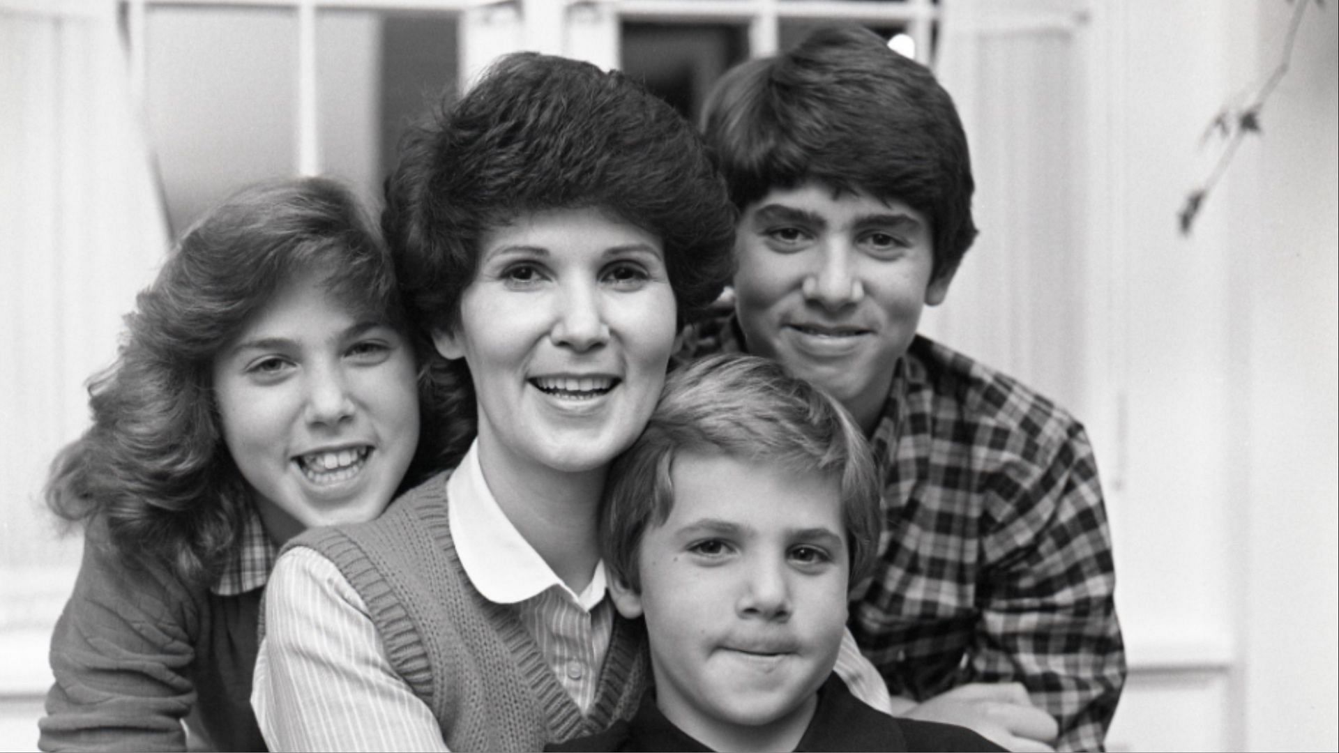 Patricia Terry Holland at home with her three children, October 14, 1981. (Images via the Church of Jesus Christ of Latter-day Saints)