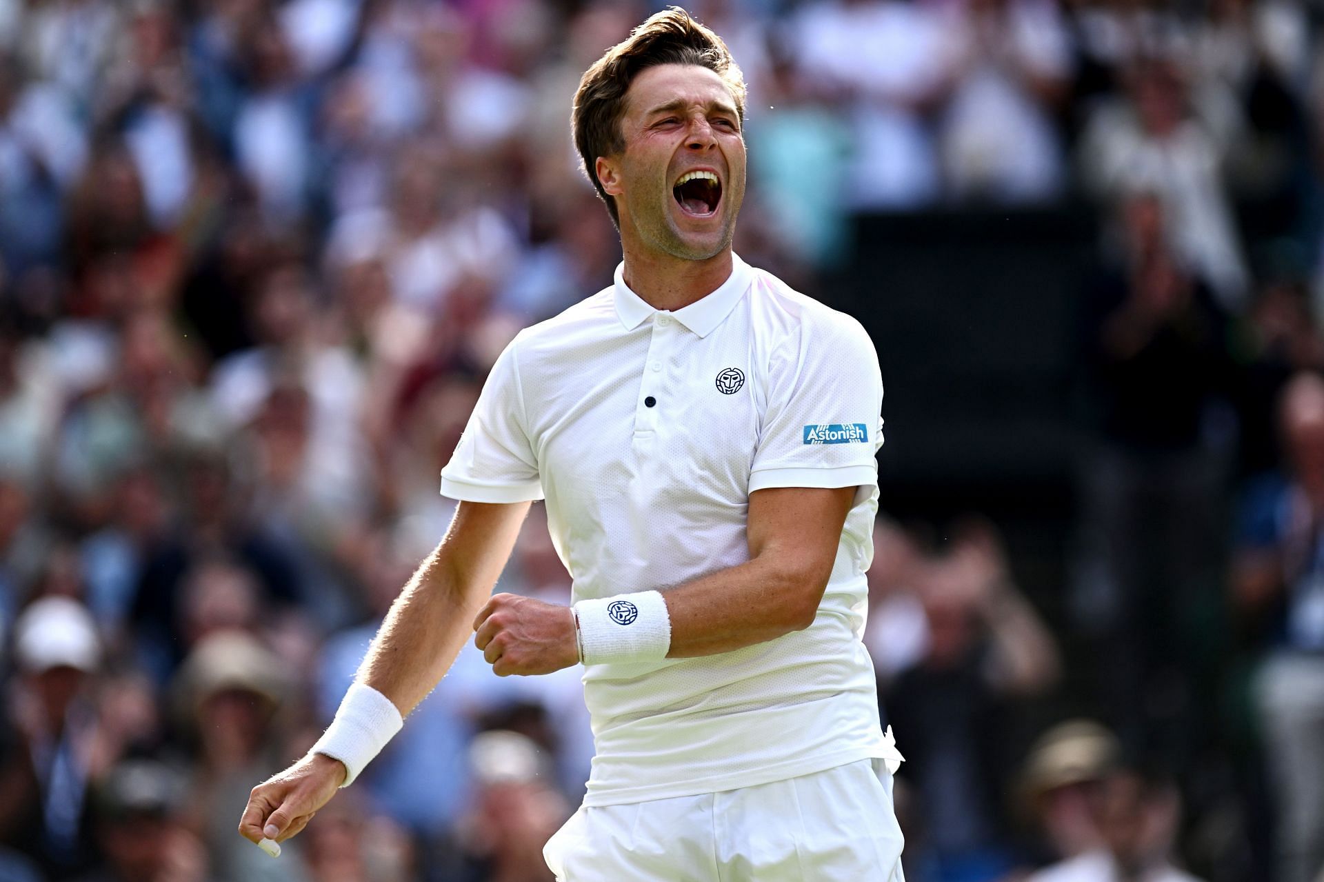 Liam Broady celebrates his victory at Wimbledon 2023