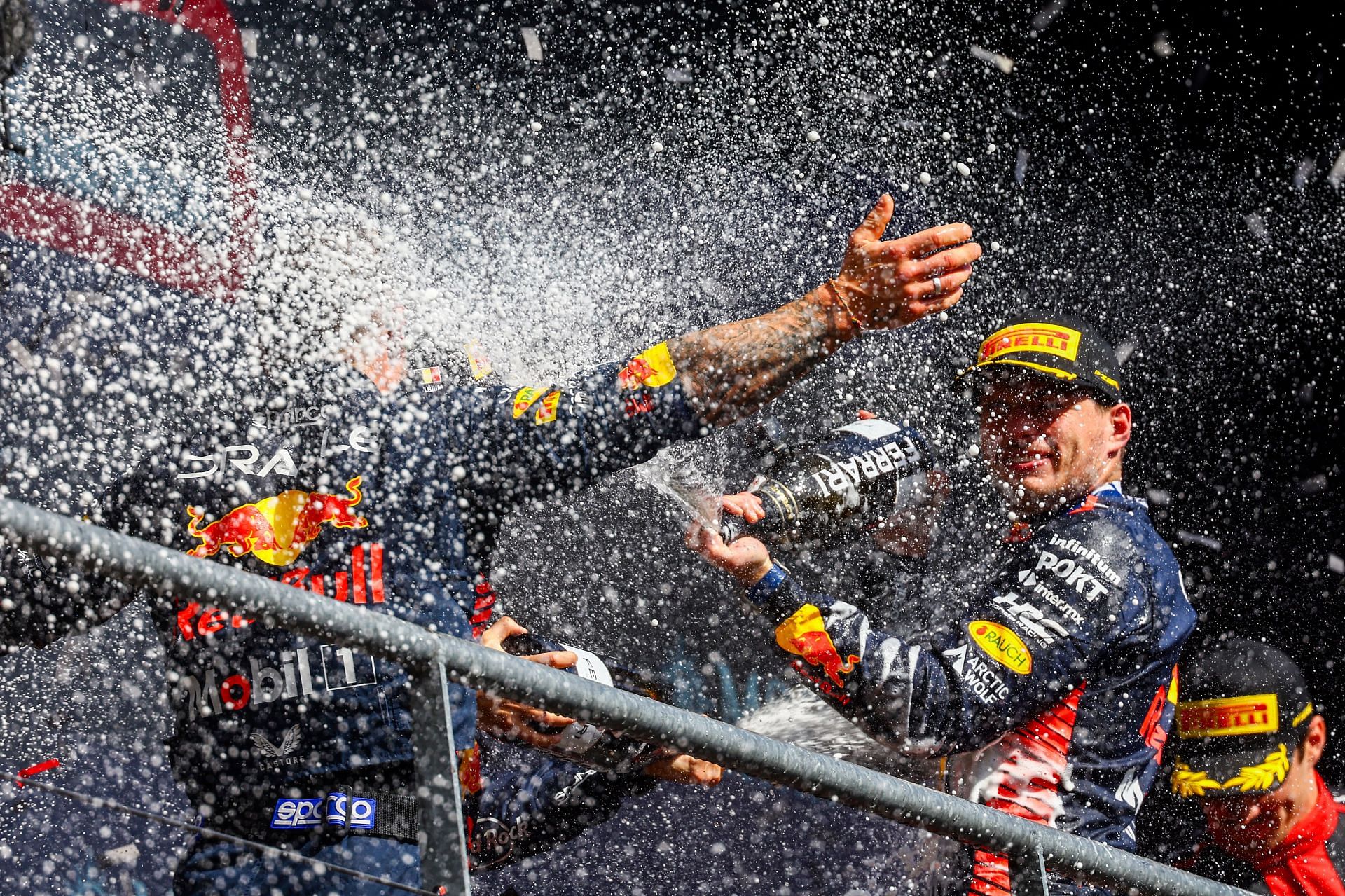 Max Verstappen celebrating his Belgian GP win with second-placed Sergio Perez and follower Charles Leclerc (Photo by Mark Thompson/Getty Images)