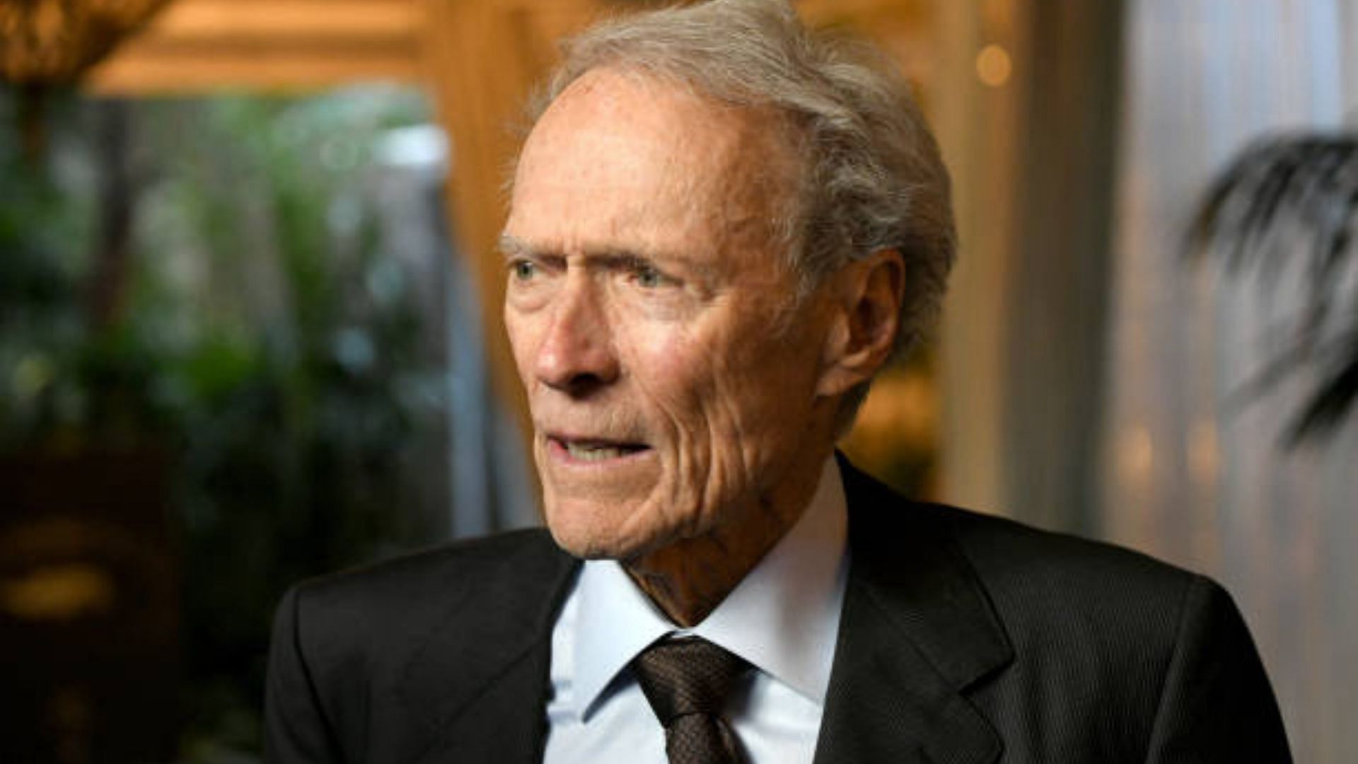 Eastwood wore his trademark frown as he looked at Margot (Image via Getty)