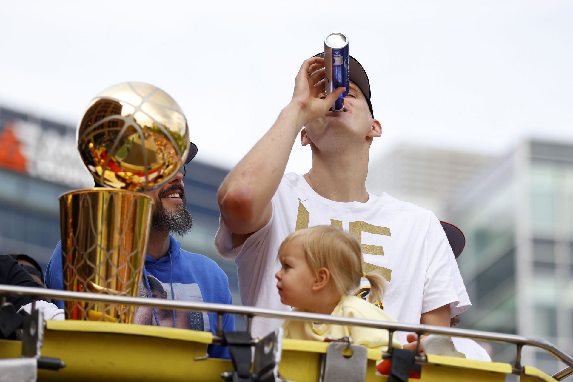 Nikola Jokic celebrating the NBA title win with his daughter.