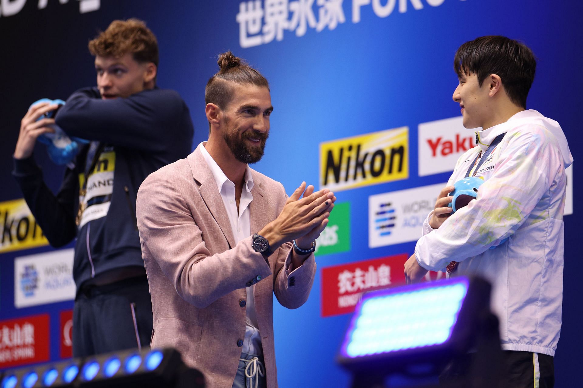 Fukuoka 2023 World Aquatics Championships: Swimming - Day 1 Bronze medallist Daiya Seto of Team Japan is congratulated by Michael Phelps