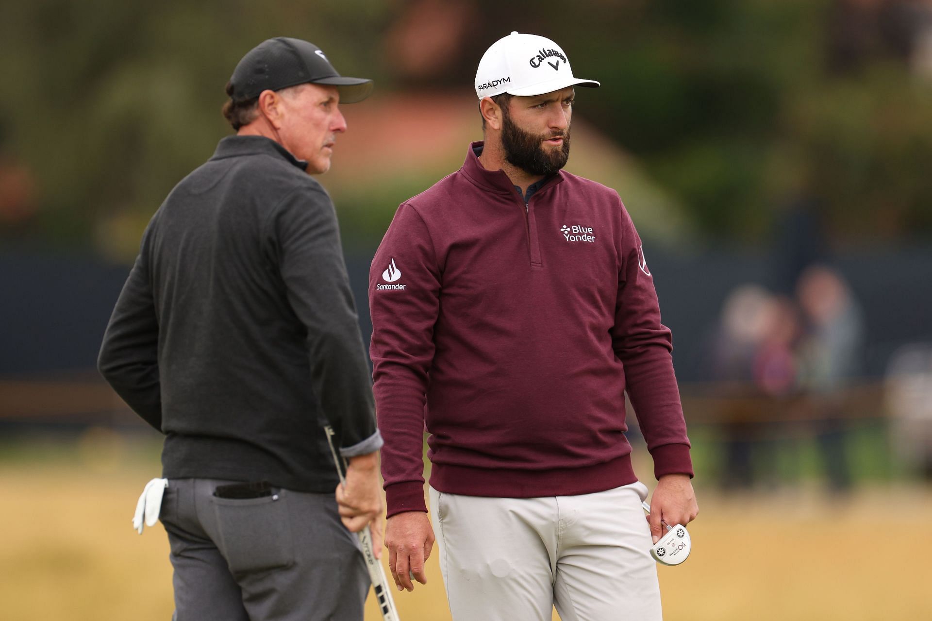 Jon Rahm and Phil Mickelson (via Getty Images)
