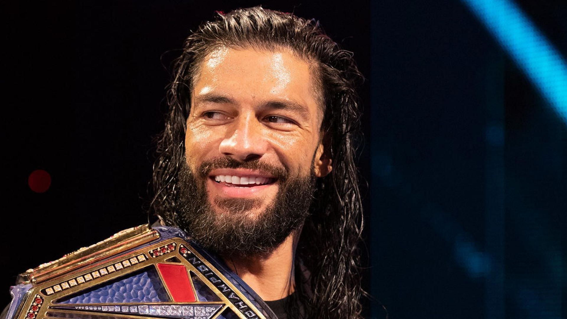 Roman Reigns smiling. Image Credits: wwe.com 