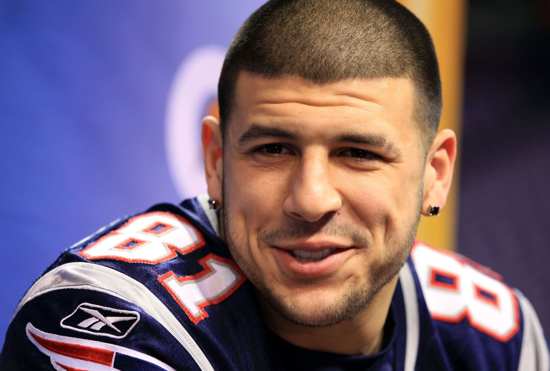 29 August 2012 - East Rutherford, New Jersey - New England Patriots tight  end Aaron Hernandez (81) looks on with his helmet in hand during warm-ups  prior to the NFL preseason game