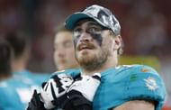 Liam Eichenberg #74 of the Miami Dolphins looks on during a preseason game against the Tampa Bay Buccaneers