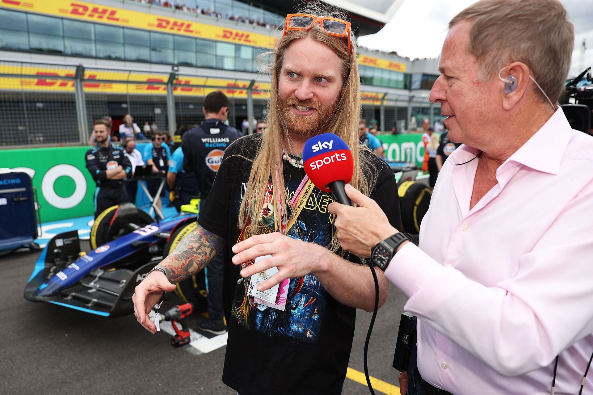 Martin Brumdle interviews Sam Ryder at the British GP Paddock (Photo by Ryan Pierse/Getty Images)