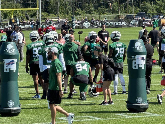 Wrestlers grapple with football at Jets camp