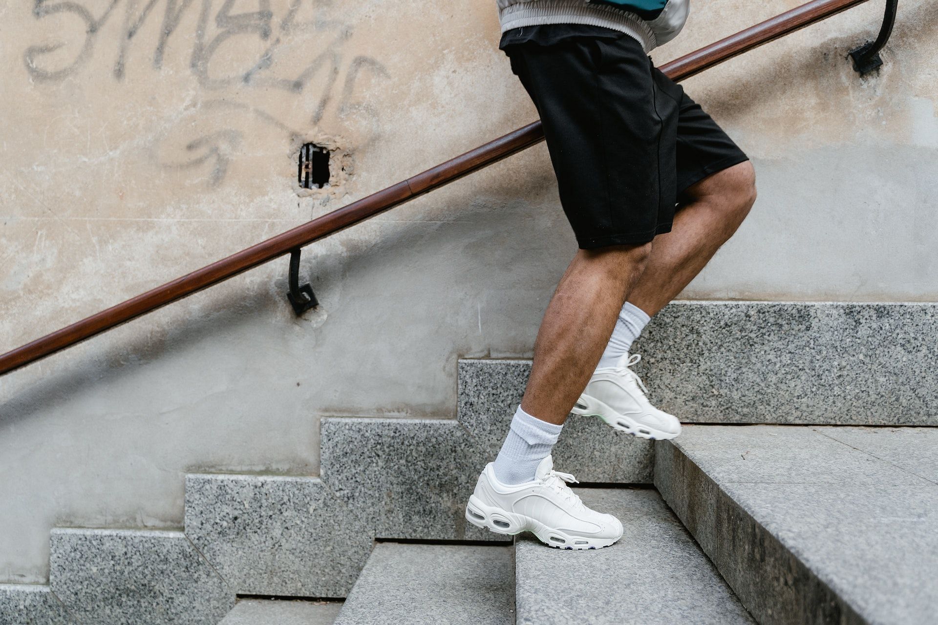 Climbing stairs for strengthening muscles. (Image via Pexels/ Mart Production)