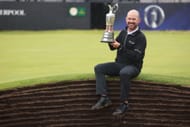 Brian Harman sitting with the Claret Jug (via Getty Images)