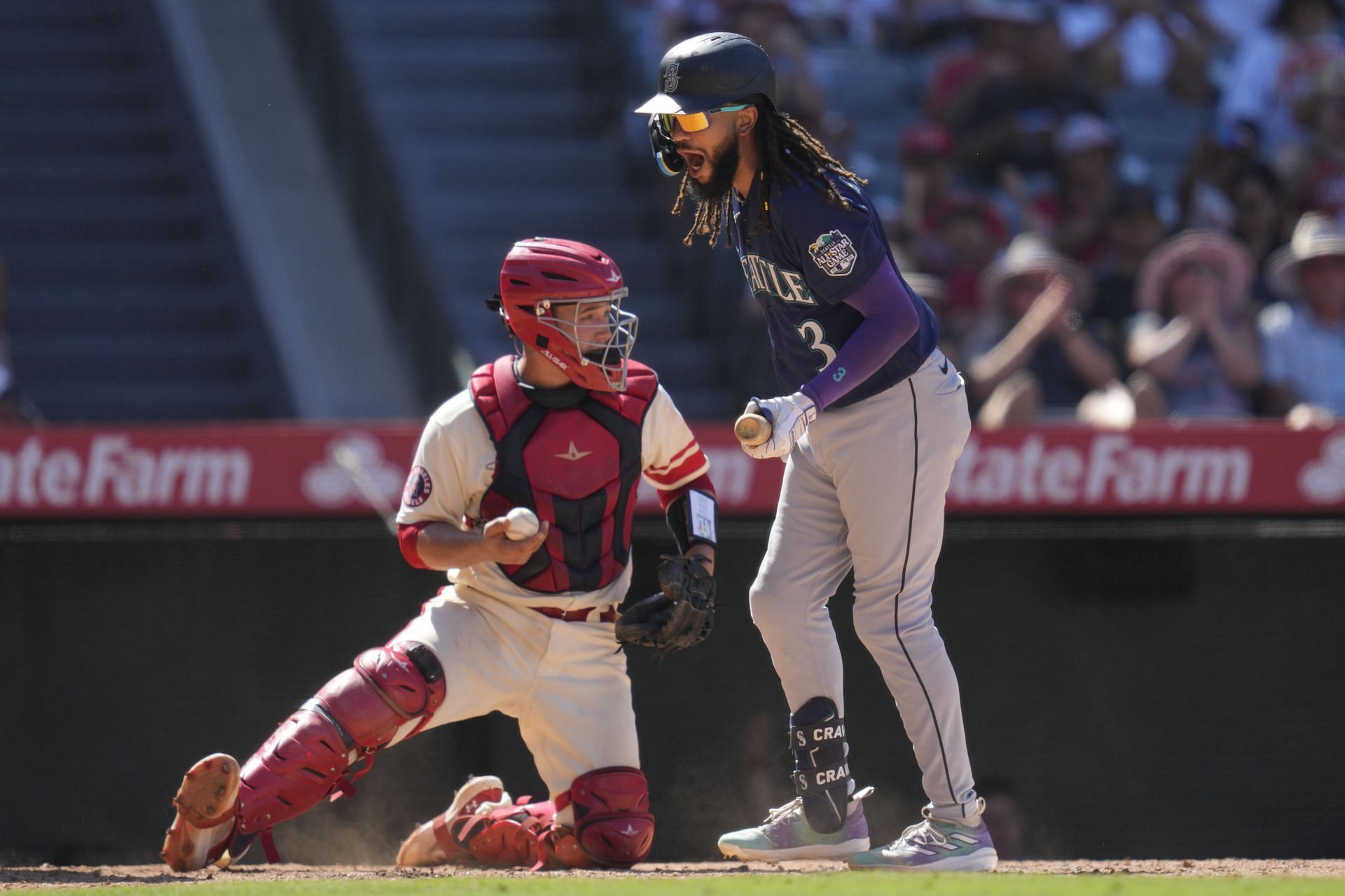 Seattle Mariners&#039; J.P. Crawford (3) reacts after striking out during the 10th inning of a baseball game against the Los Angeles Angels in Anaheim, Calif., Sunday, Aug. 6, 2023. (AP Photo/Ashley Landis)