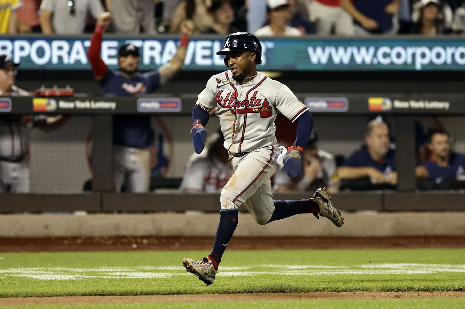 Atlanta Braves&#039; Ozzie Albies runs home to score during the eighth inning in the second baseball game of a doubleheader on Saturday, Aug. 12, 2023, in New York. (AP Photo/Adam Hunger)