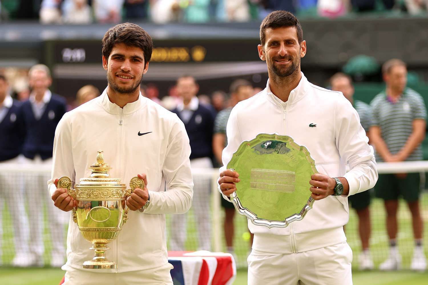 Carlos Alcaraz and Novak Djokovic pose at the 2023 Wimbledon trophy ceremony