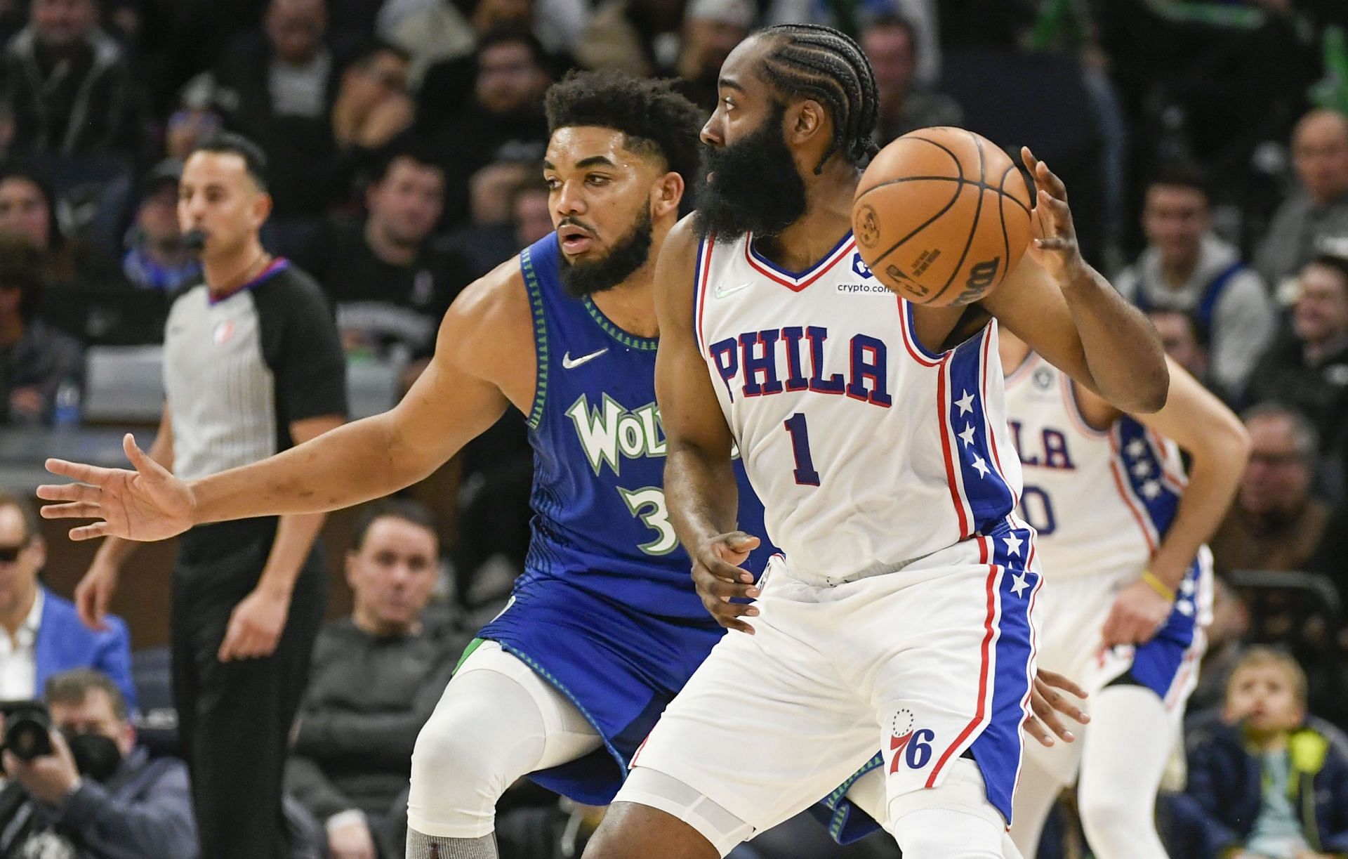 Karl-Anthony Towns (left) of the Minnesota Timberwolves guarding James Harden