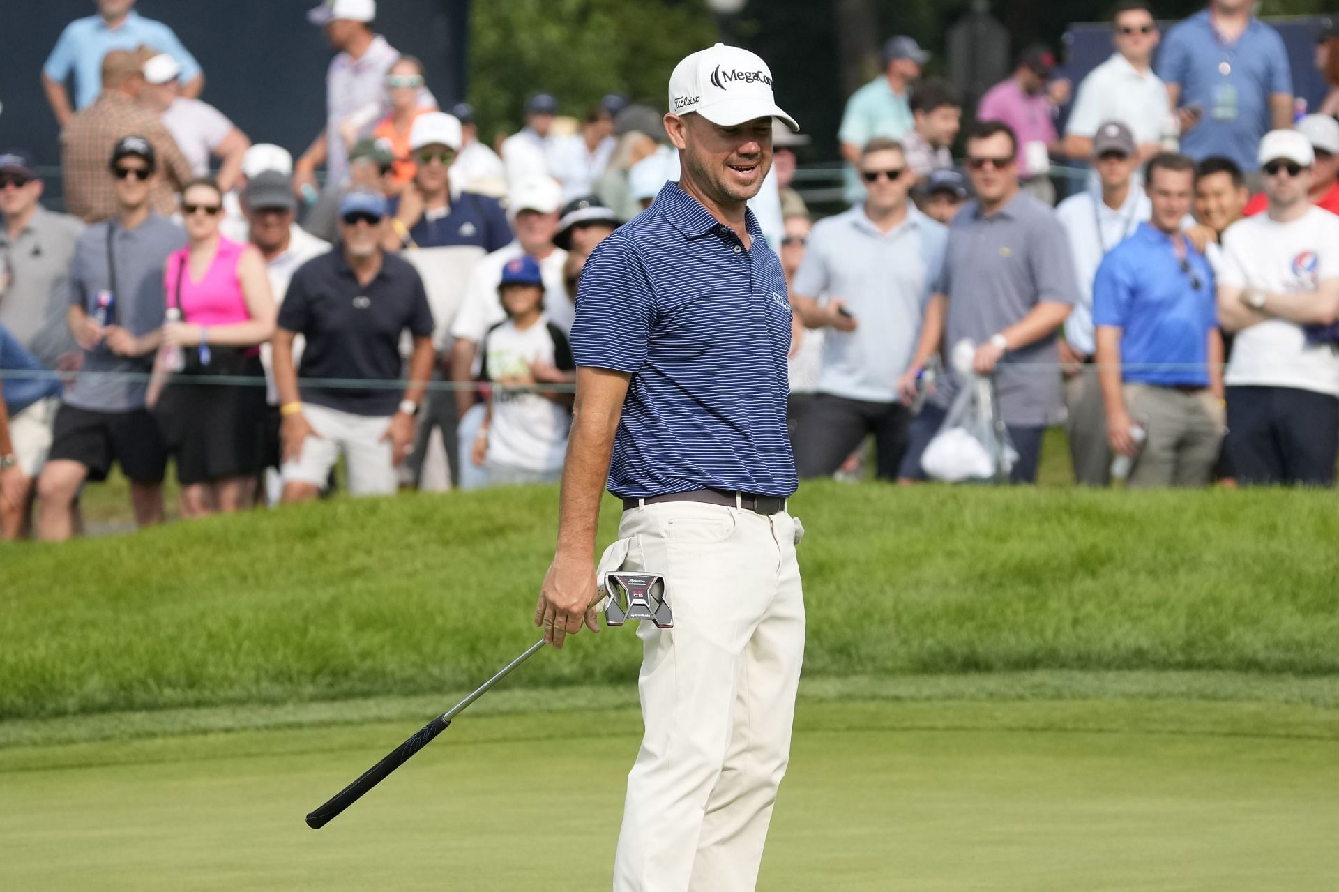 Brian Harman reacts after missing a birdie put on the 18th green during the second round of the BMW Championship