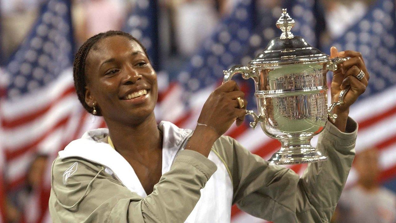 Venus Williams poses with the 2001 US Open trophy