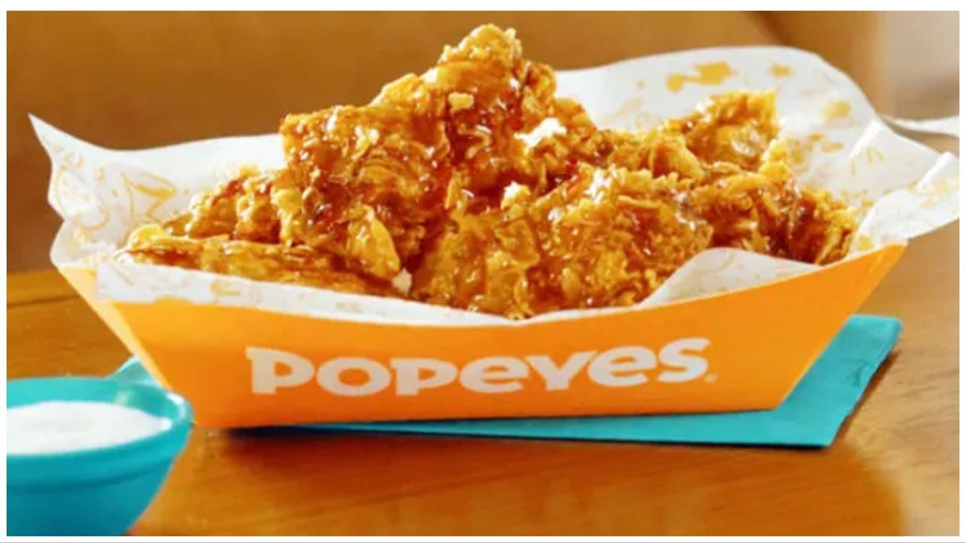 Popeyes serving chicken wings dipped in champagne and gold flakes