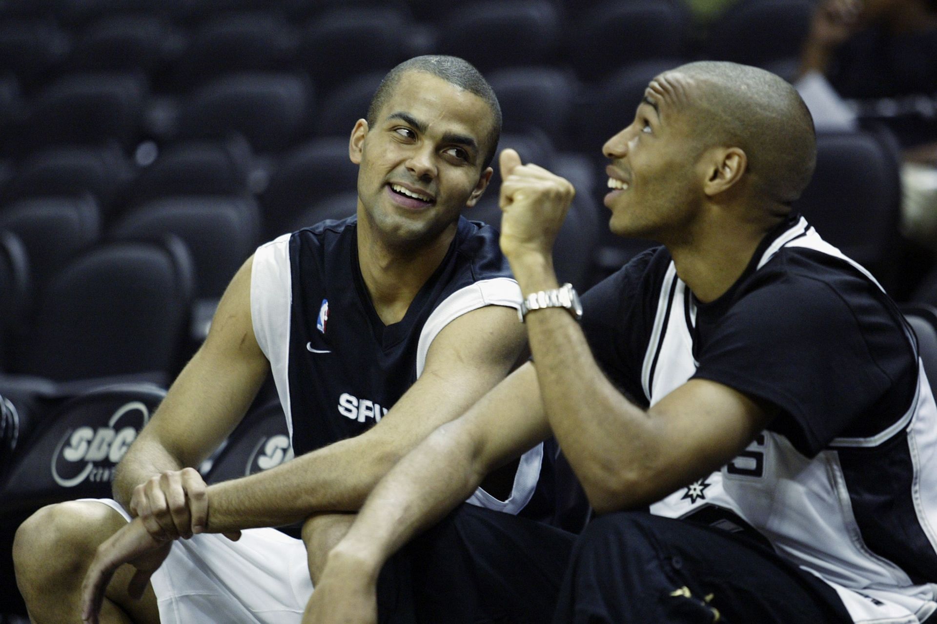 Tony Parker, left, talks with Thierry Henry.