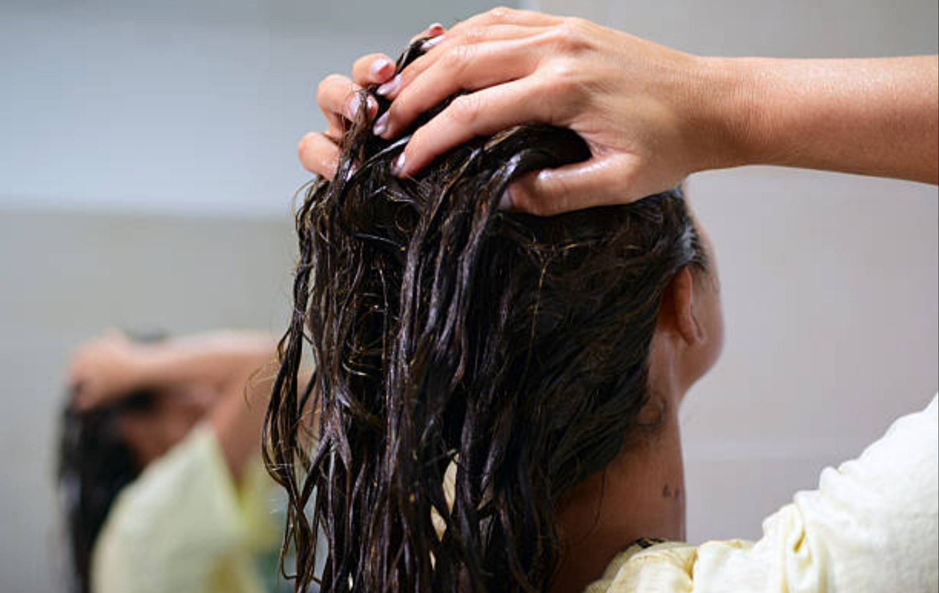 The first step to getting that mirror-like gloss is to keep your hair moisturized (Image via iStock)