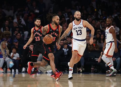 Gary Trent Jr. defended by Evan Fournier (right)