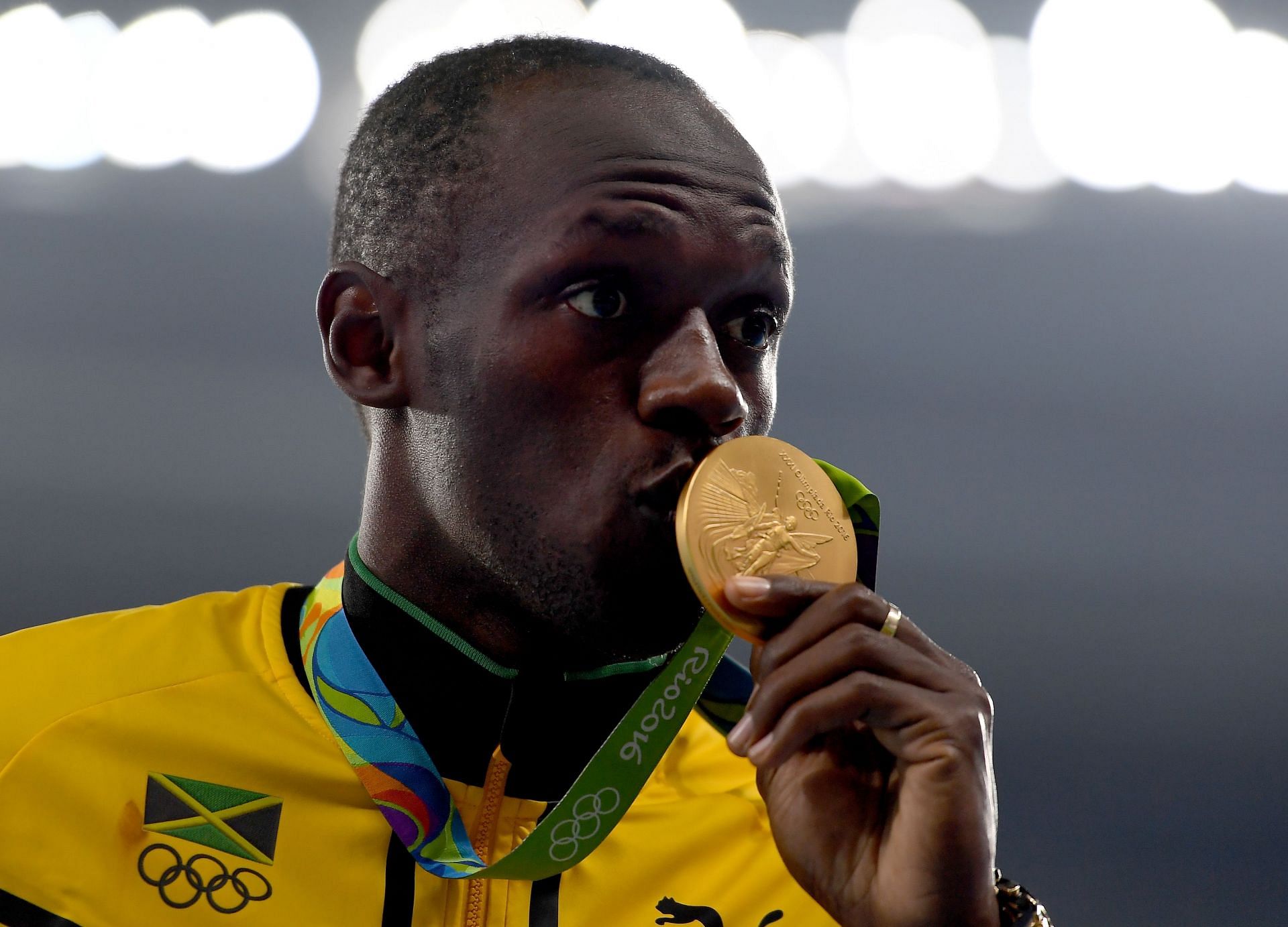 Usain Bolt poses on the podium during the medal ceremony after winning a gold medal in men&#039;s 200m at the 2016 Rio Olympics in Rio de Janeiro Brazil