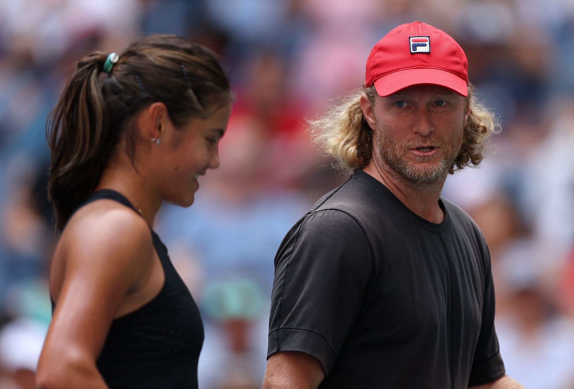 Emma Raducanu pictured with Dmitry Tursunov during the 2022 US Open.
