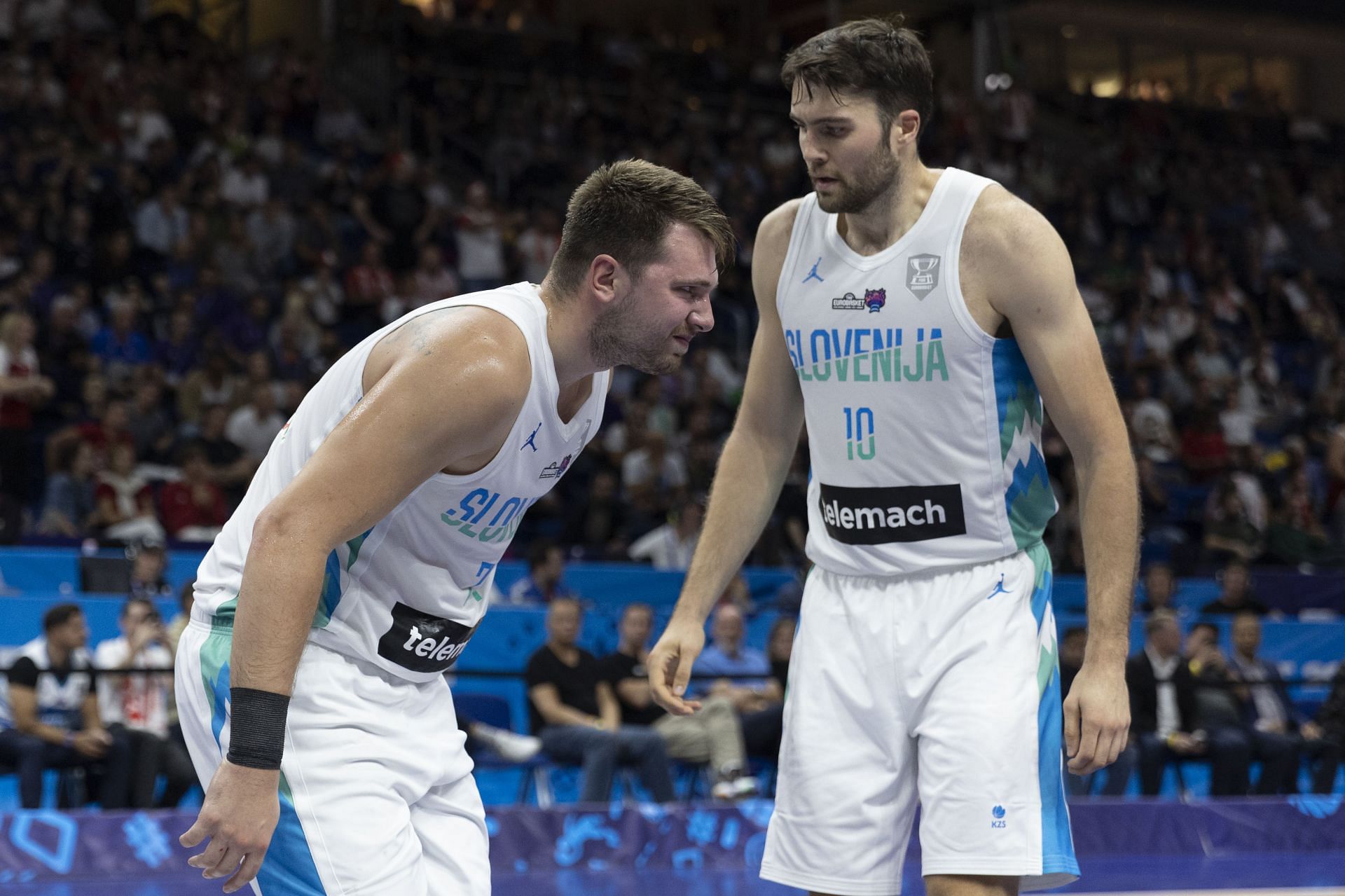 Luka Doncic (left) and Mike Tobey of Slovenia