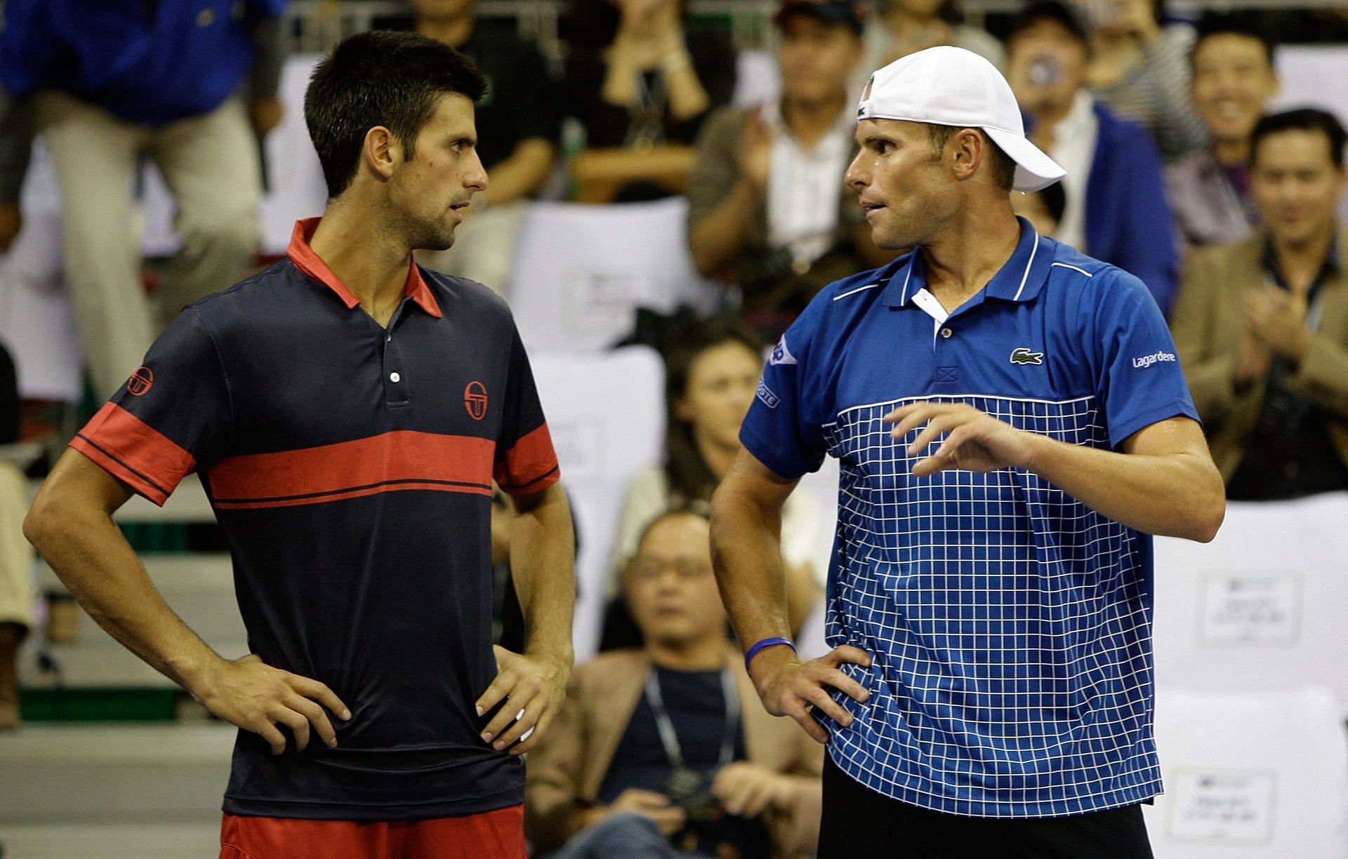 Novak Djokovic and Andy Roddick interact after a match.
