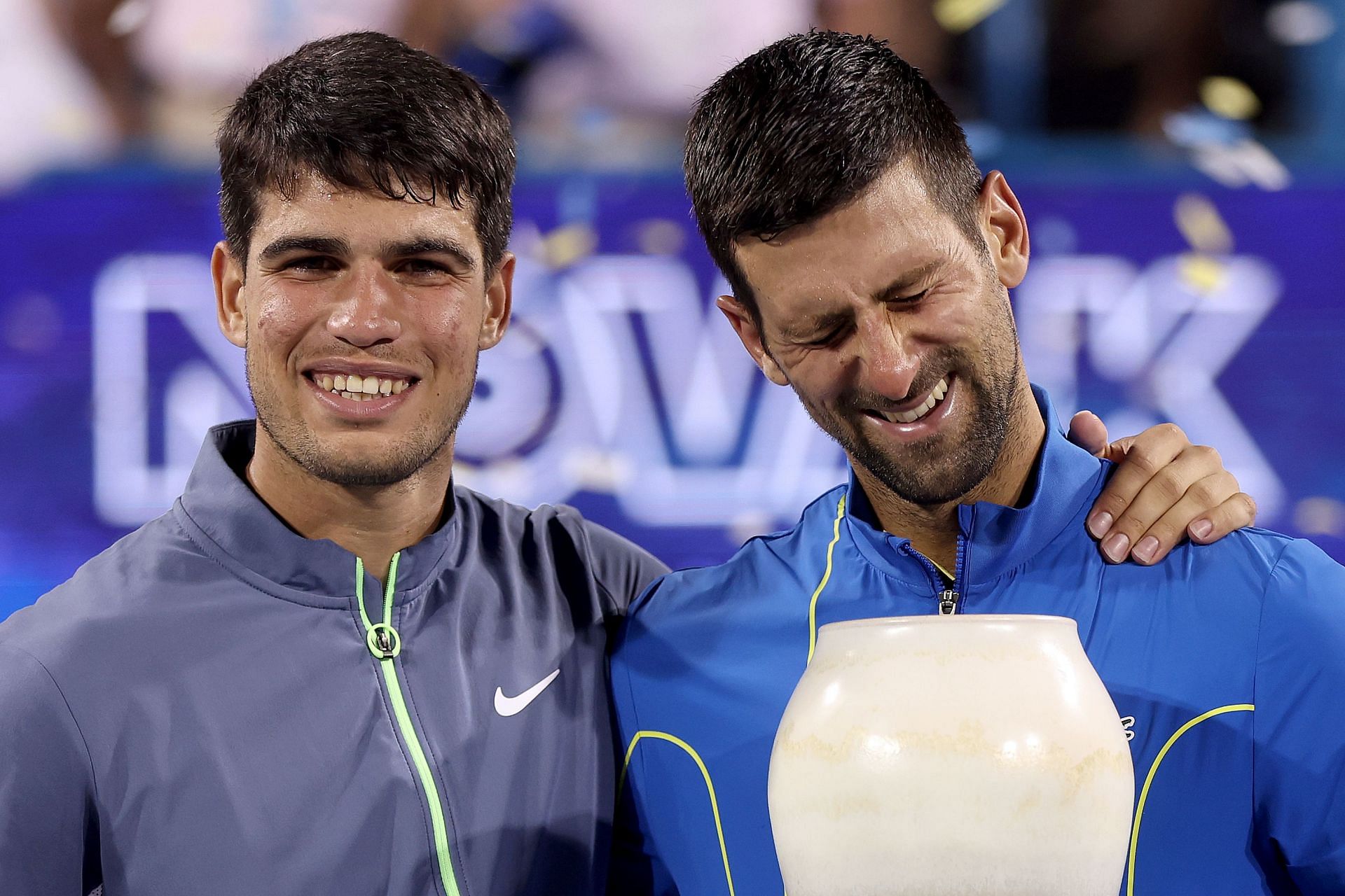 Carlos Alcaraz and Novak Djokovic share a light moment.