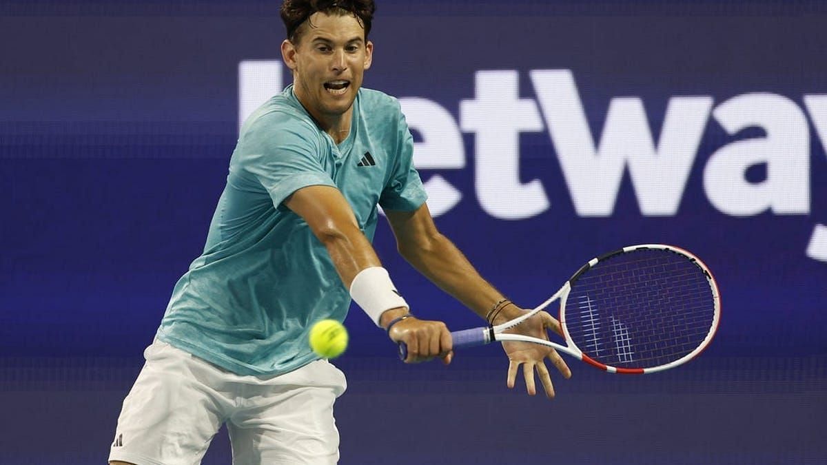 Dominic Thiem hits a single-handed backhand