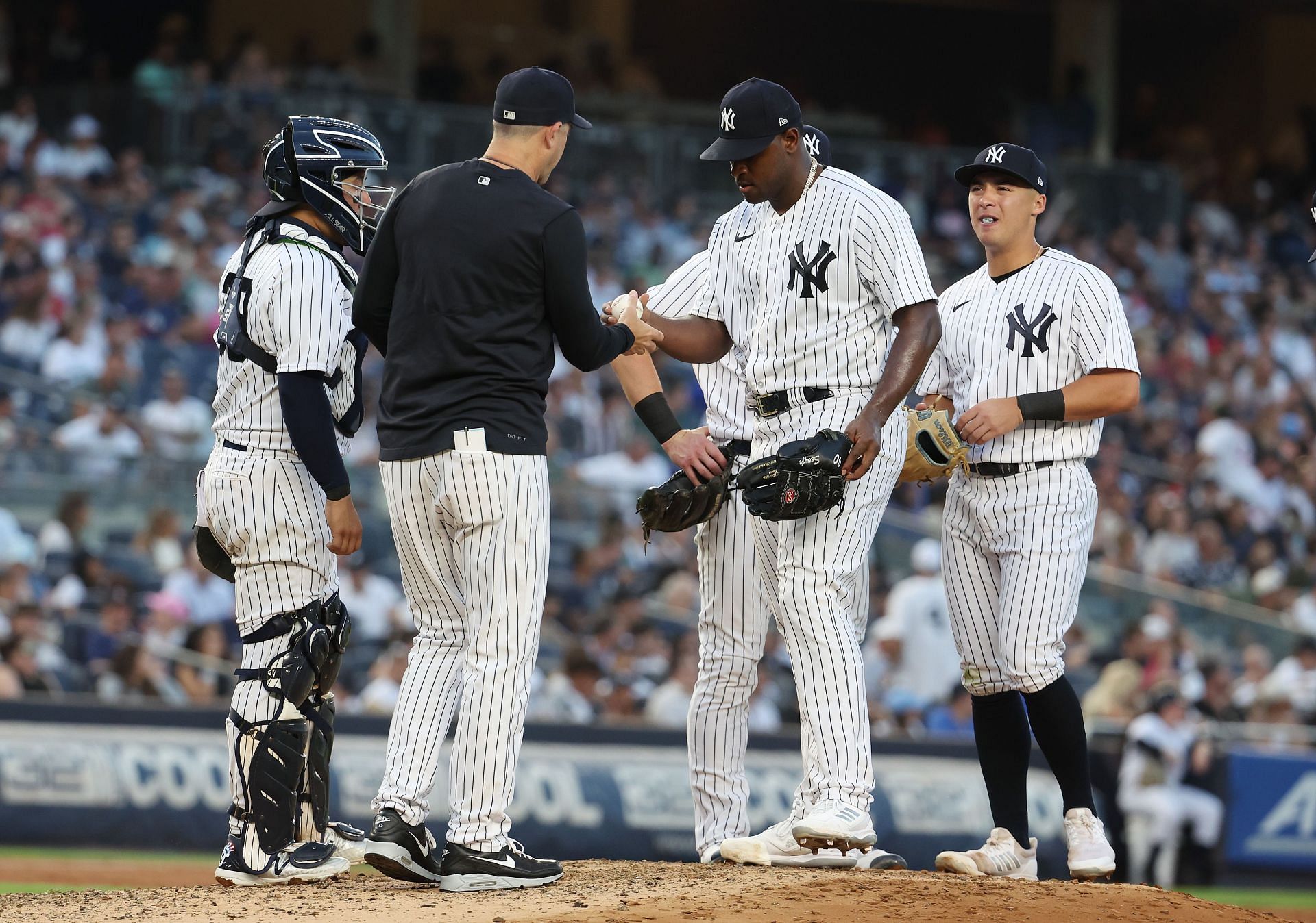 Luis Severino of the New York Yankees is pulled from the game by Manager Aaron Boone at Yankee Stadium