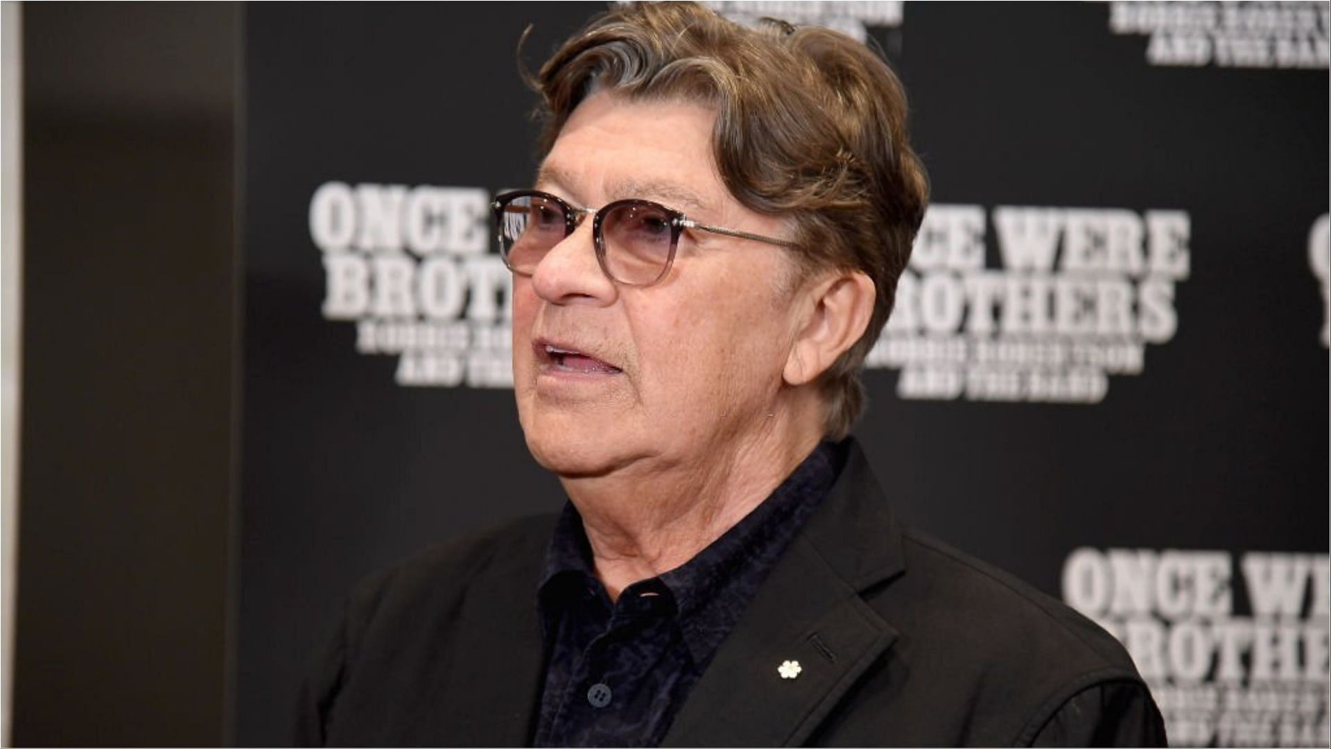 Robbie Robertson recently died at the age of 80 (Image via Gary Gershoff/Getty Images)