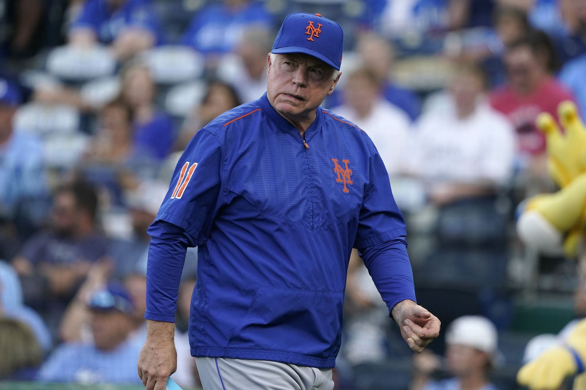 Manager Buck Showalter of the New York Mets walks to the dugout at Kauffman Stadium