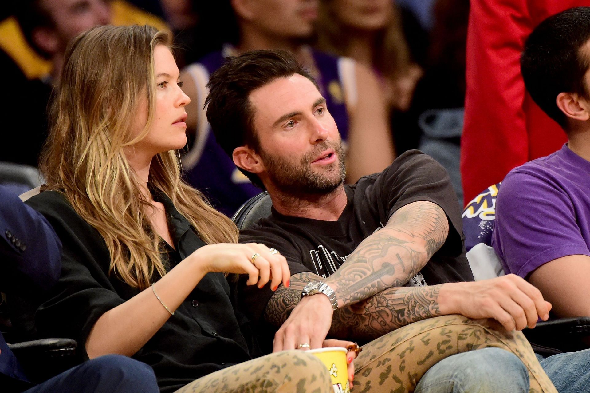 Behati Prinsloo and Adam Levine in an LA Lakers game