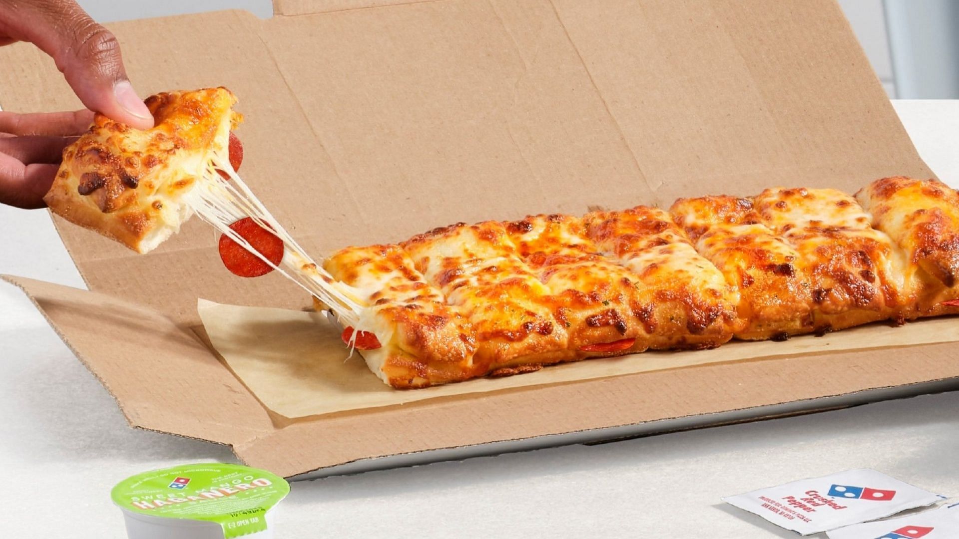 The new Pepperoni Stuffed Cheesy Bread hits stores starting August 21 (Image via Domino&rsquo;s)