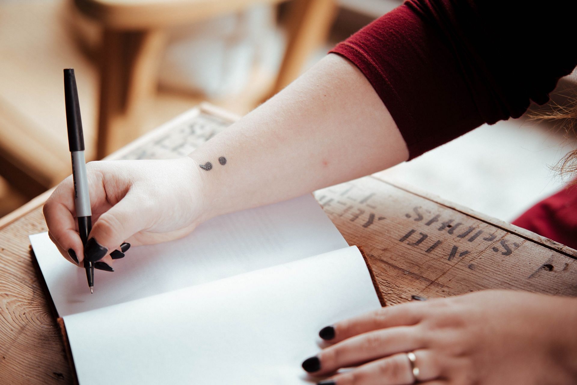 Perhaps mental health tattoos gained momentum because of the semicolon. It brought into light so many experiences. (Image via Unsplash/Timothy I Brock)