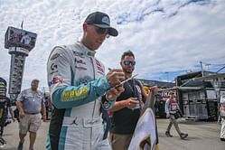 “You wonder why you’re booed everywhere”: NASCAR fans react to Denny Hamlin ‘taking the L’ after Michael McDowell beats Chase Elliott in Indy
