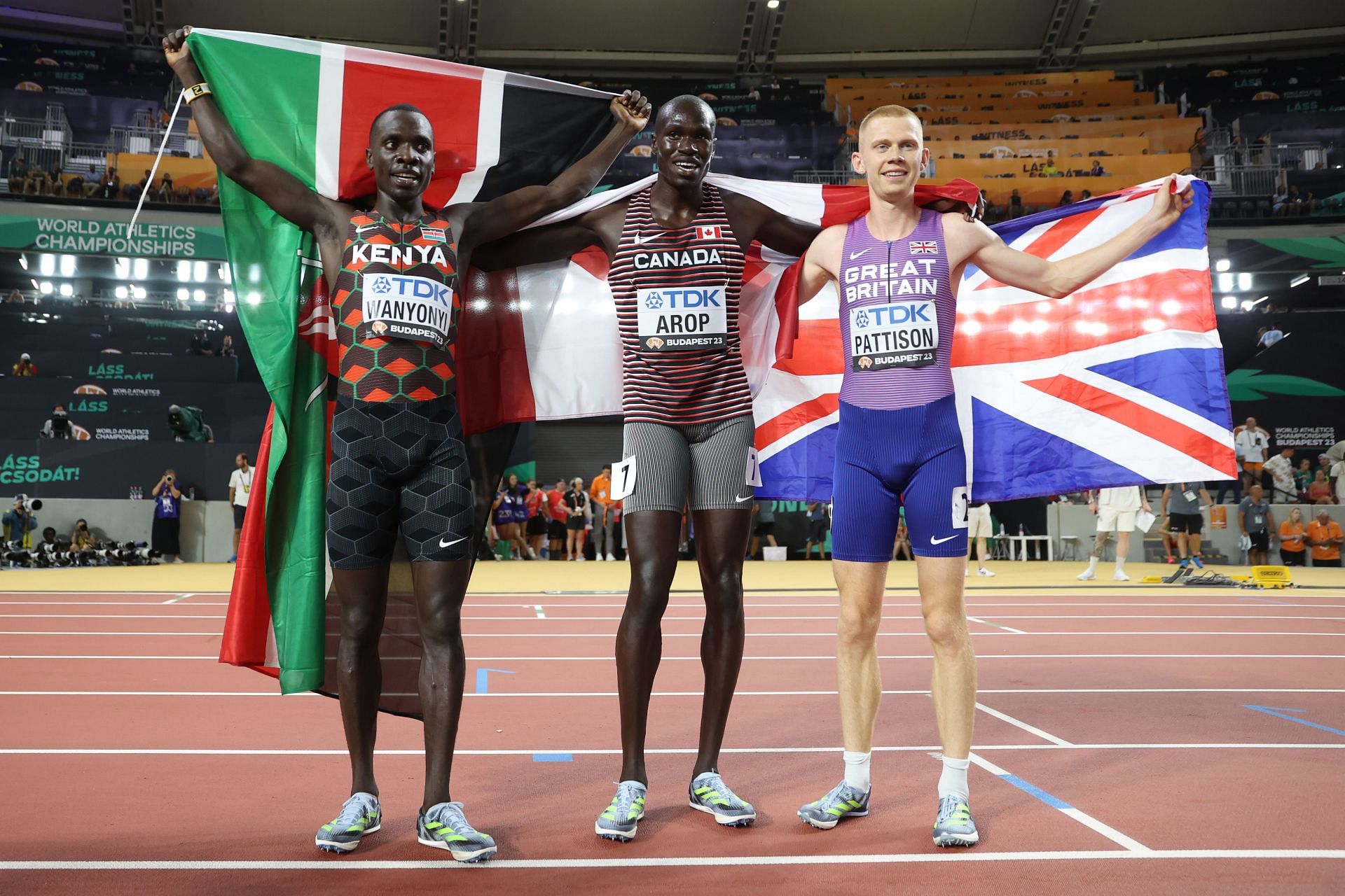 Silver medalist Emmanuel Wanyonyi of Team Kenya, gold medalist Marco Arop of Team Canada, and bronze medalist Ben Pattison of Team Great Britain pose for a photo after the Men&#039;s 800m Final during day eight of the World Athletics Championships Budapest 2023