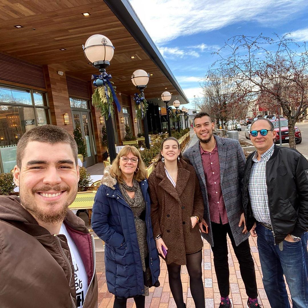 Juancho Hernangomez with his parents and family