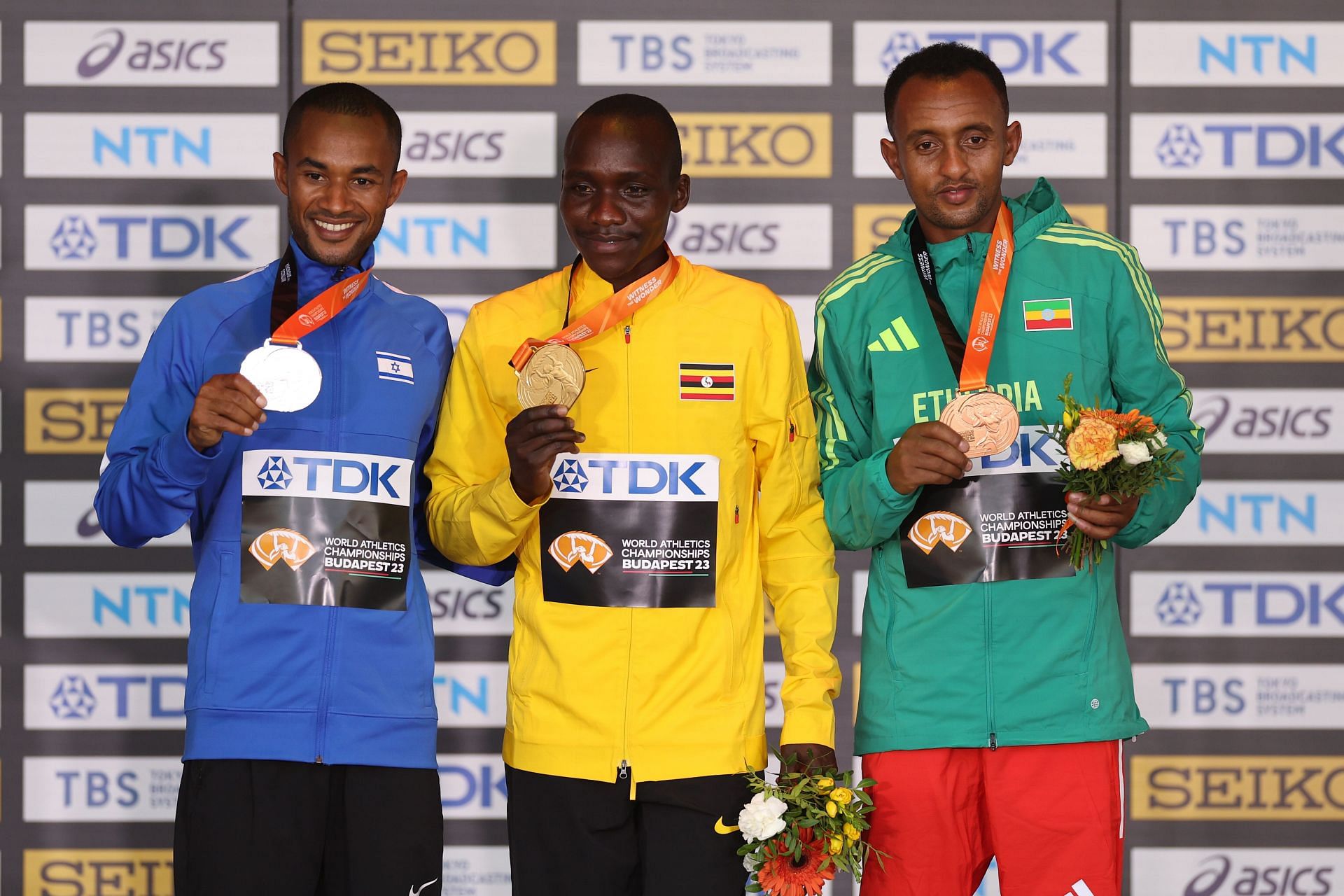 Silver medalist Maru Teferi of Team Israel, gold medalist Victor Kiplangat of Team Uganda, and bronze medalist Leul Gebresilase of Team Ethiopia during Day 9 of the 2023 World Athletics Championships