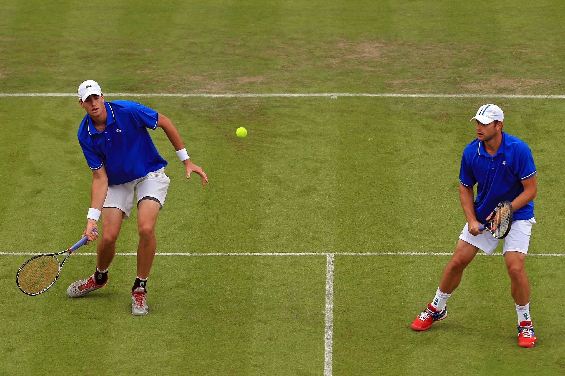 John Isner and Andy Roddick in action during the 2012 Olympics 