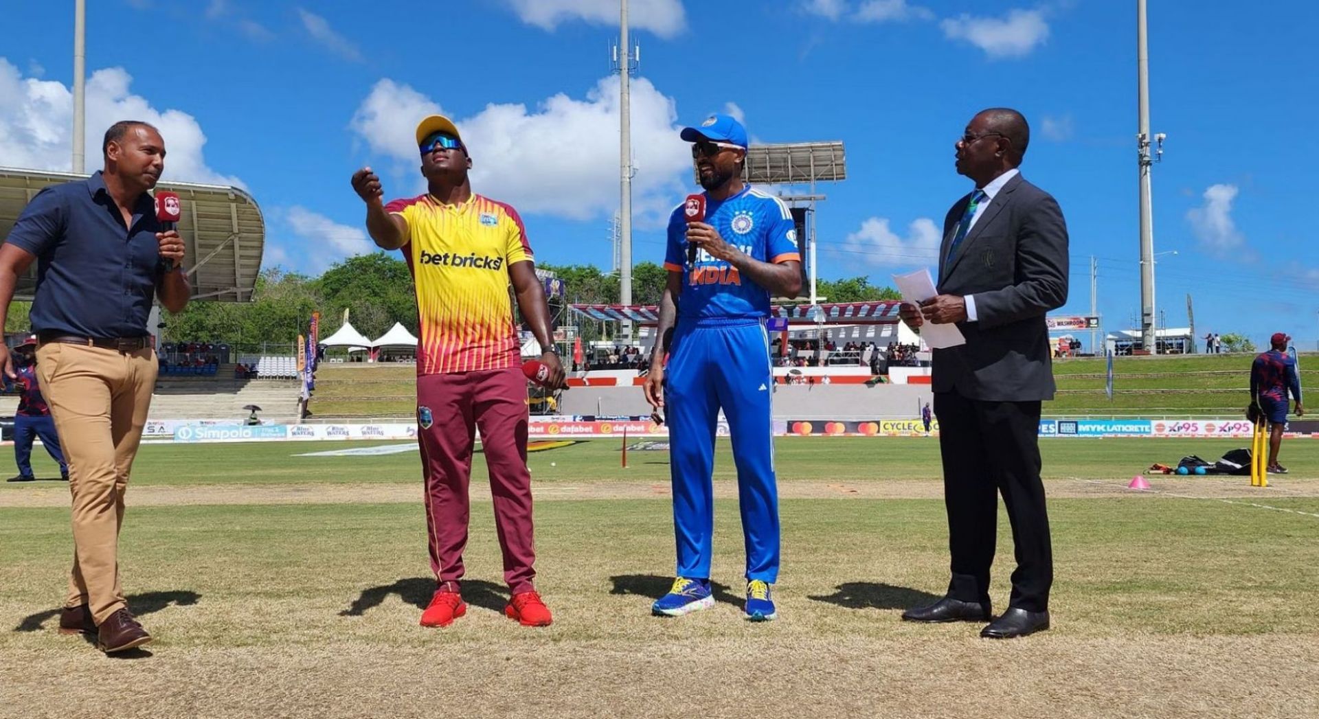 Rovman Powell and Hardik Pandya at the toss.