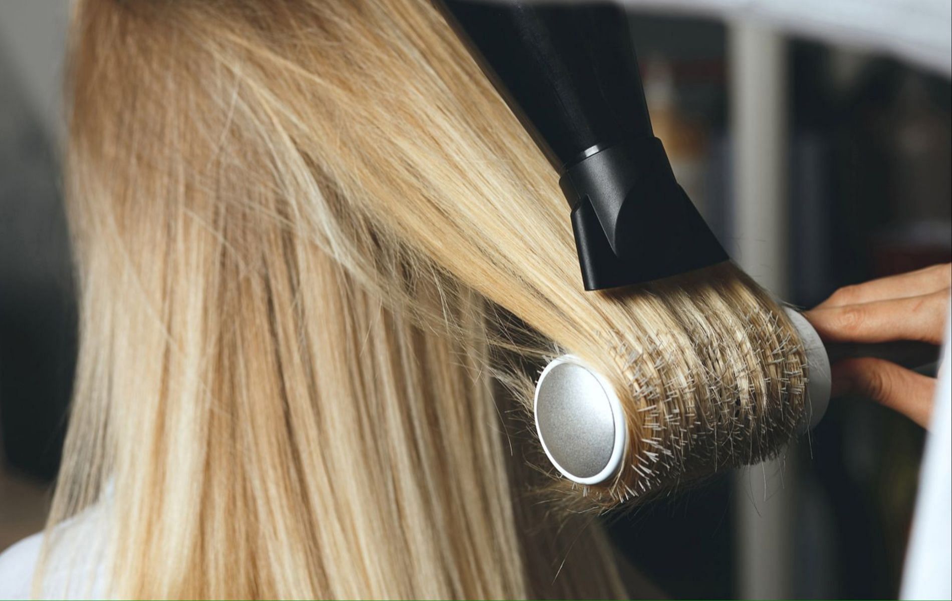 Blow drying with a fitted nozzle will give you the desired glass hair effect. (Image via InStyle)