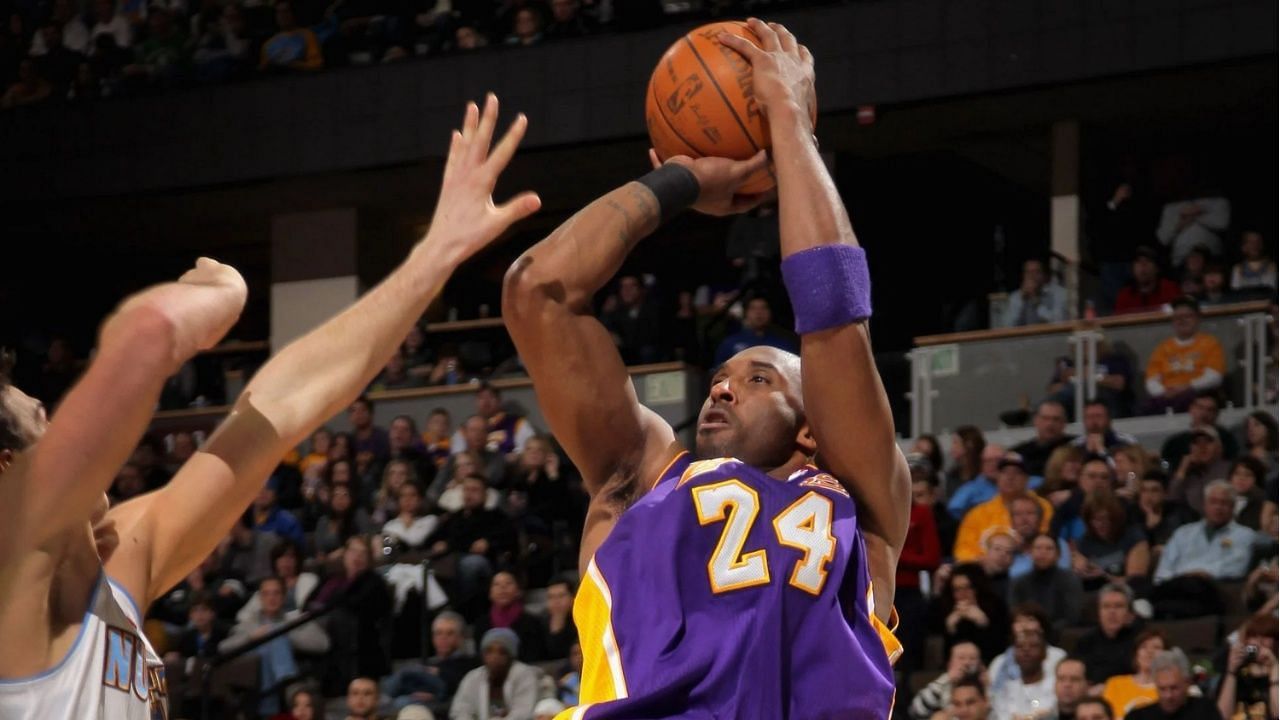 Kobe Bryant of the LA Lakers using his patented fadeaway jumper.
