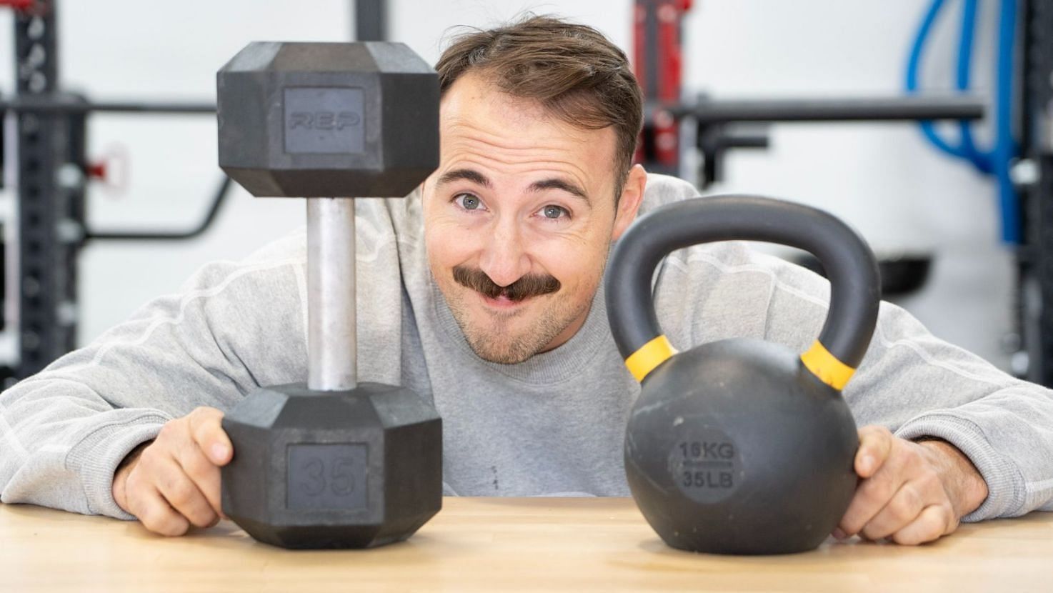 Dumbbell vs. Kettlebell (Image via Getty Images)