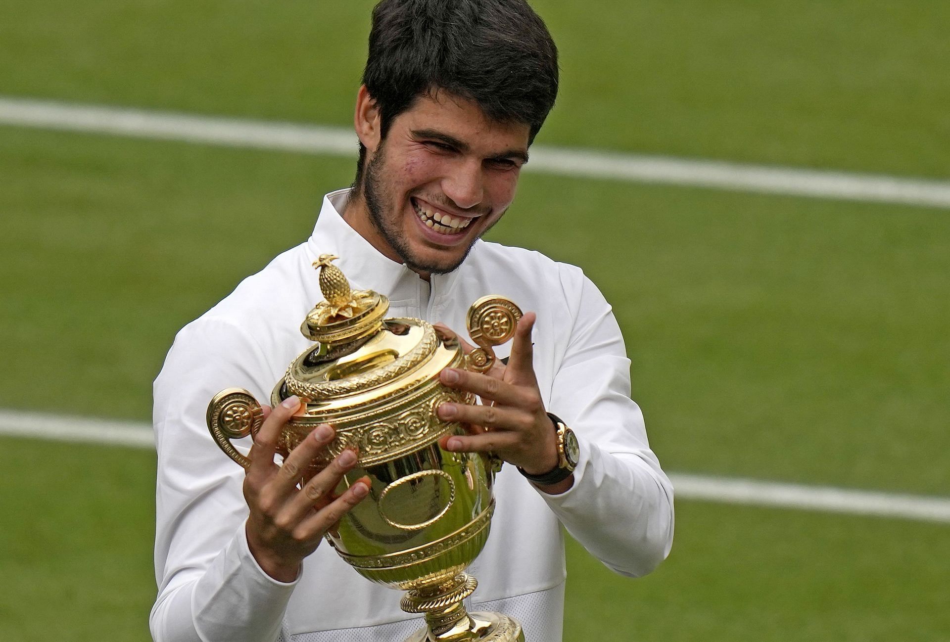 Carlos Alcaraz with the 2023 Wimbledon Championships trophy