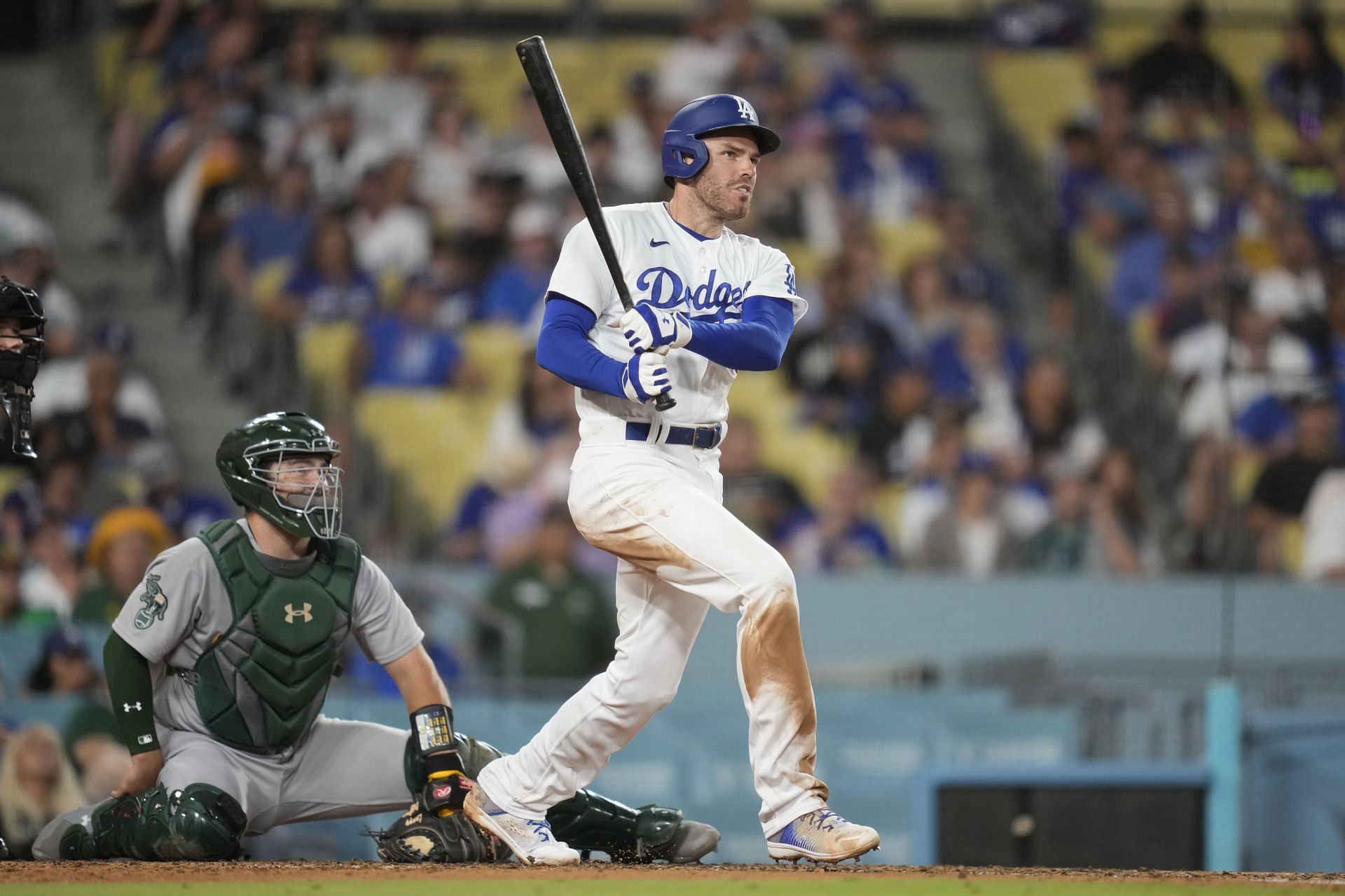 Los Angeles Dodgers' Freddie Freeman doubles against the Oakland Athletics at Dodger Stadium