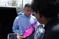 PSG superstar Kylian Mbappe spotted on holiday with 2 bikini-clad women in Sardinia amid transfer speculation